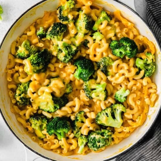 a bowl of macaroni and cheese with broccoli.