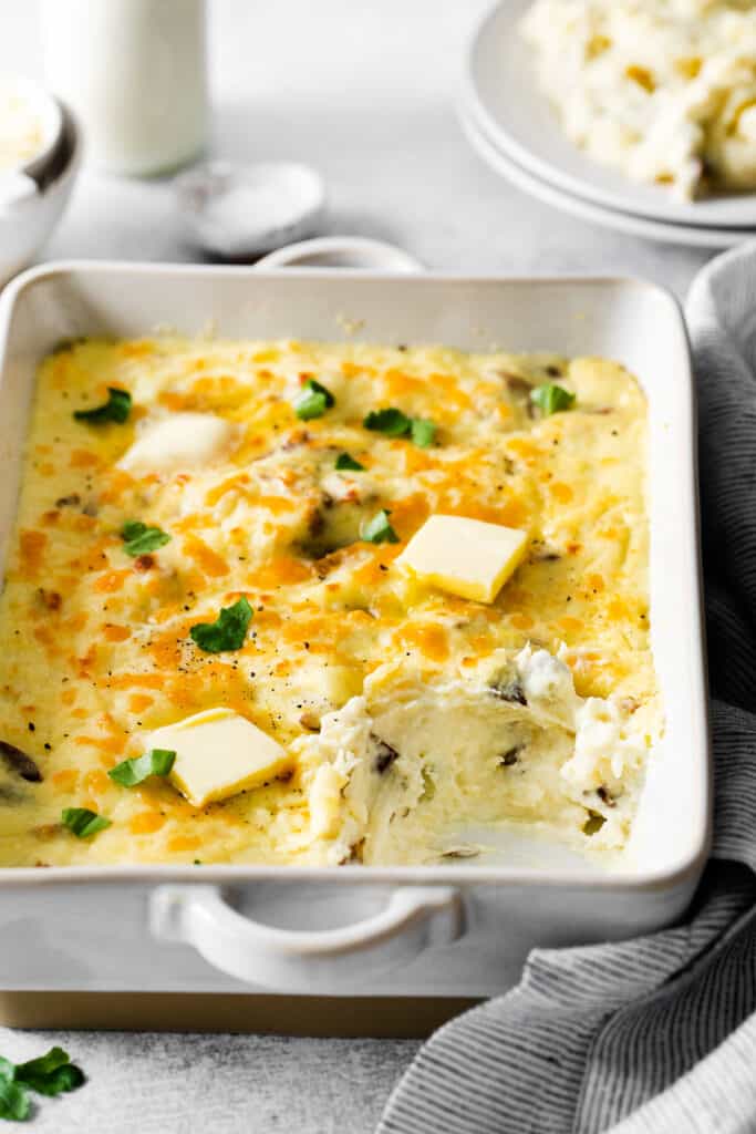 Cheesy mashed potatoes in a casserole dish. 