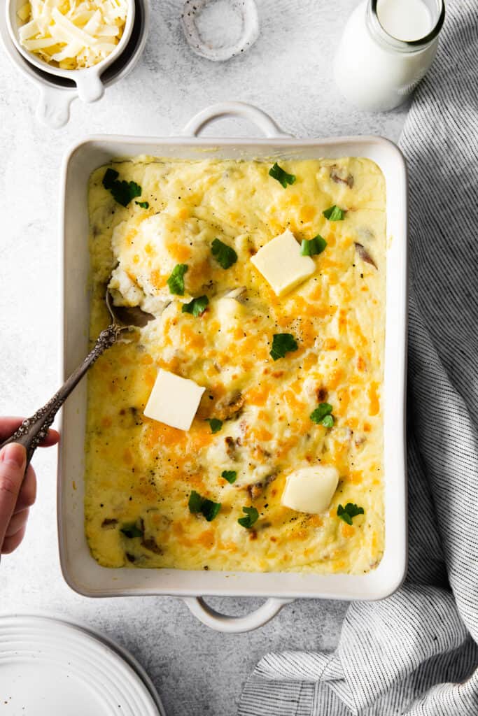 Cheesy mashed potatoes with melted butter. 