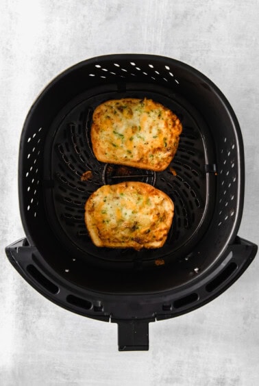 Texas toast slices in an air fryer.