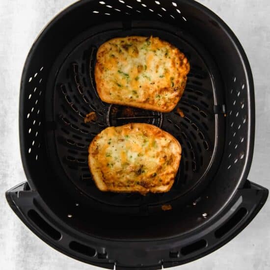 Texas toast slices in an air fryer.