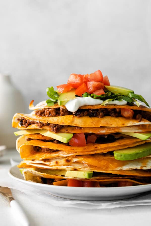 a stack of quesadillas on a plate.