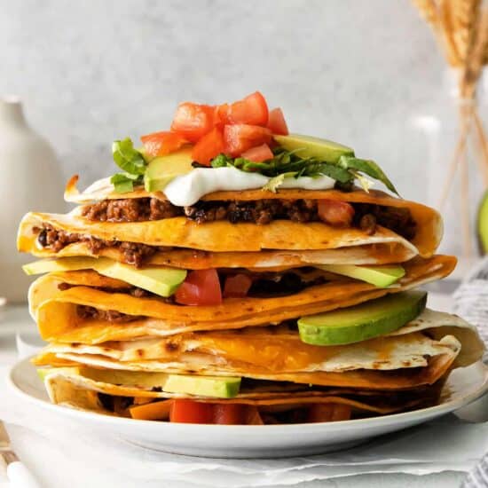 a stack of quesadillas on a plate.