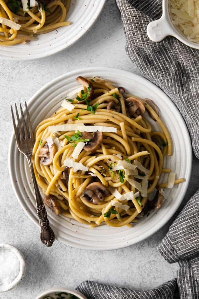 mushroom pasta on a plate with a fork
