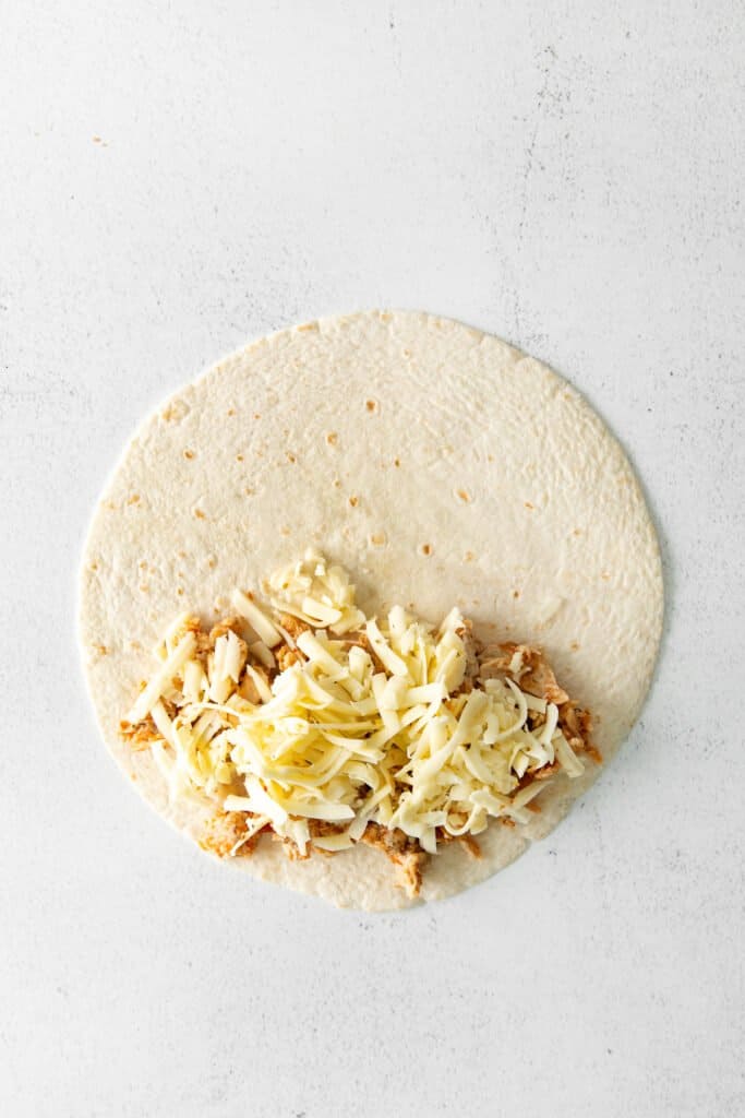 chicken and cheese on tortilla.