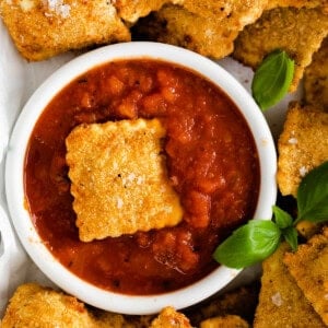 Air fryer ravioli served with marinara.