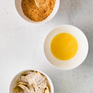 Dip the floured ravioli into the bread crumb mixture before cooking.