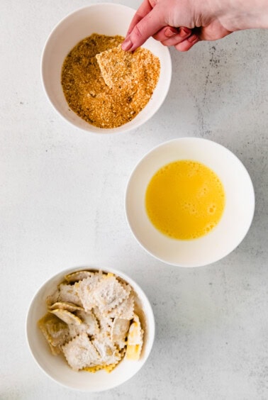 Dip the floured ravioli into the bread crumb mixture before cooking.