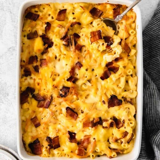 macaroni and cheese with bacon in a baking dish.