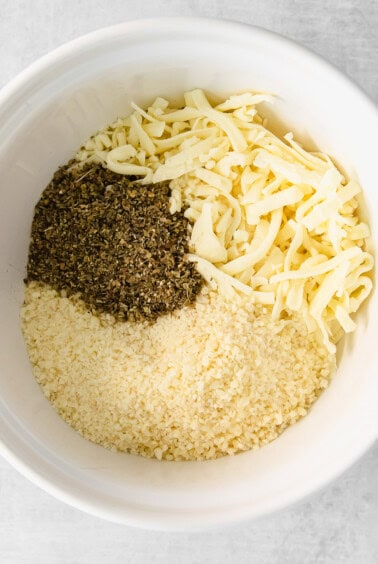 Cheese and spices in a mixing bowl.