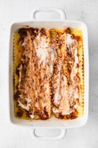 lasagna in a white baking dish.