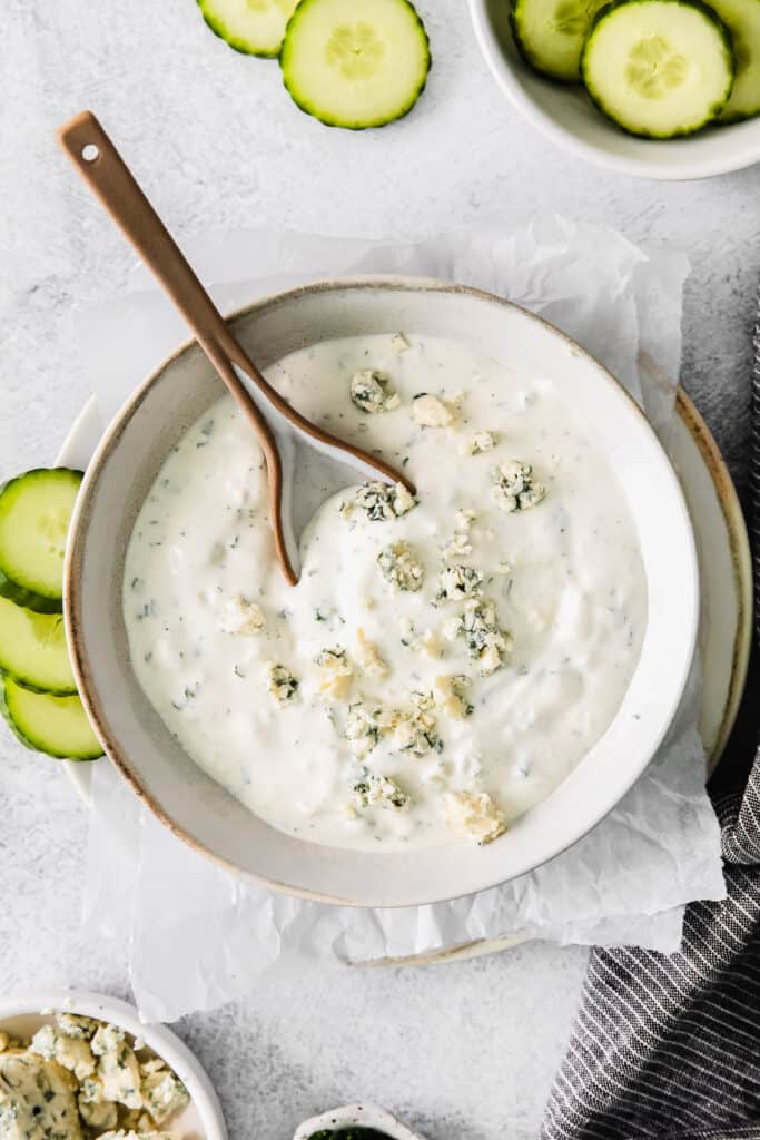blue cheese dip in a bowl with a spoon