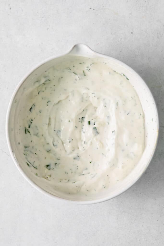 blue cheese dip an dressing mixed together in a bowl