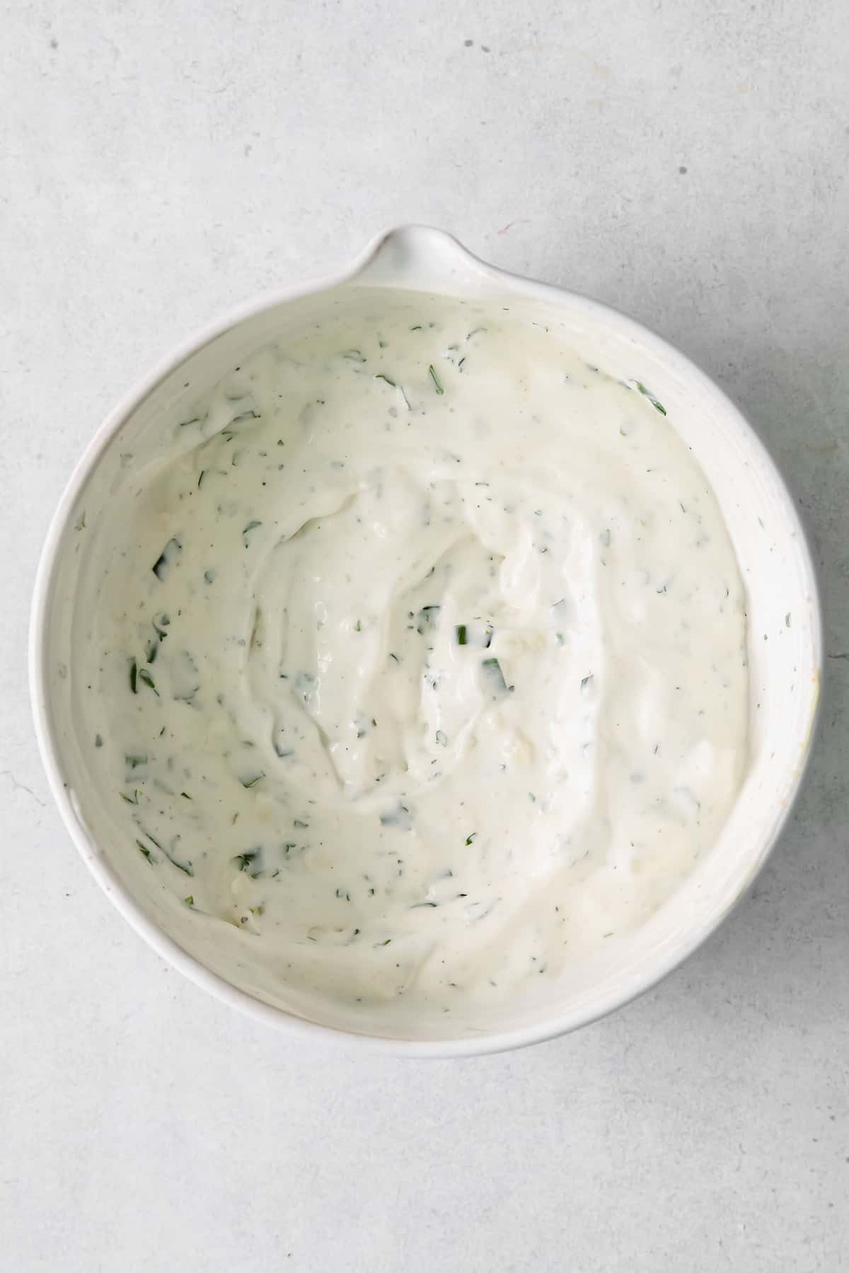 blue cheese dip an dressing mixed together in a bowl