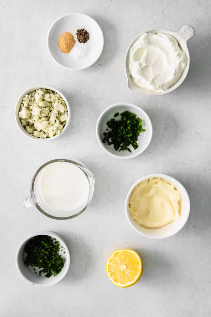 ingredients for blue cheese dip and dressing in bowls