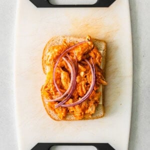 grilled cheese on cutting board.