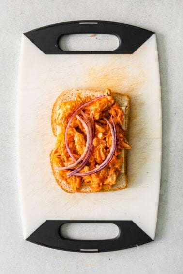 grilled cheese on cutting board.