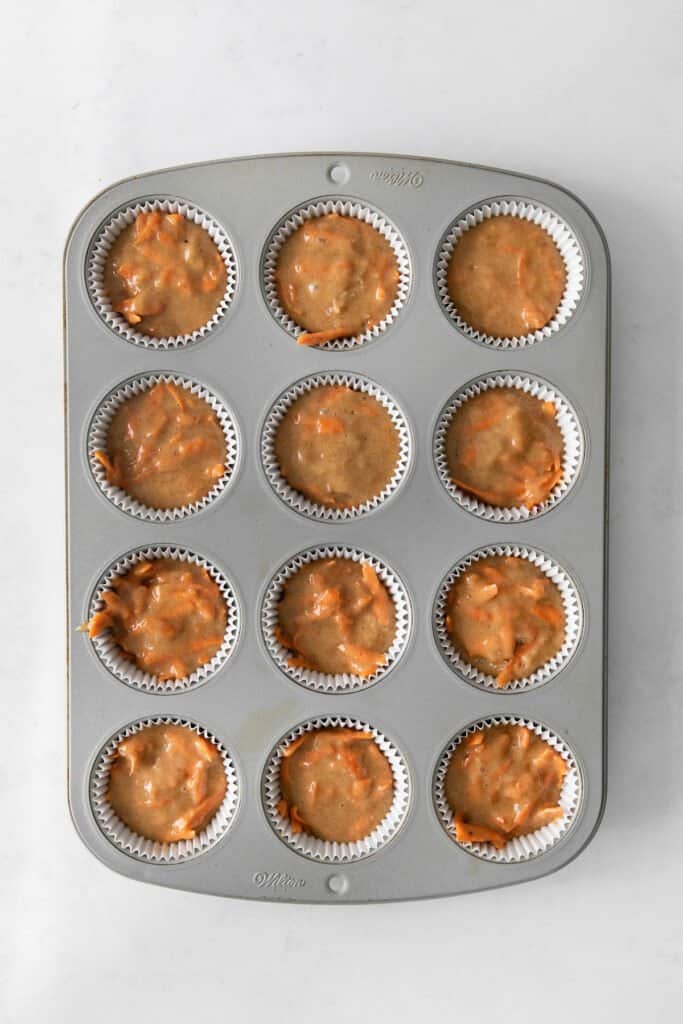 Carrot cake batter in cupcake papers. 