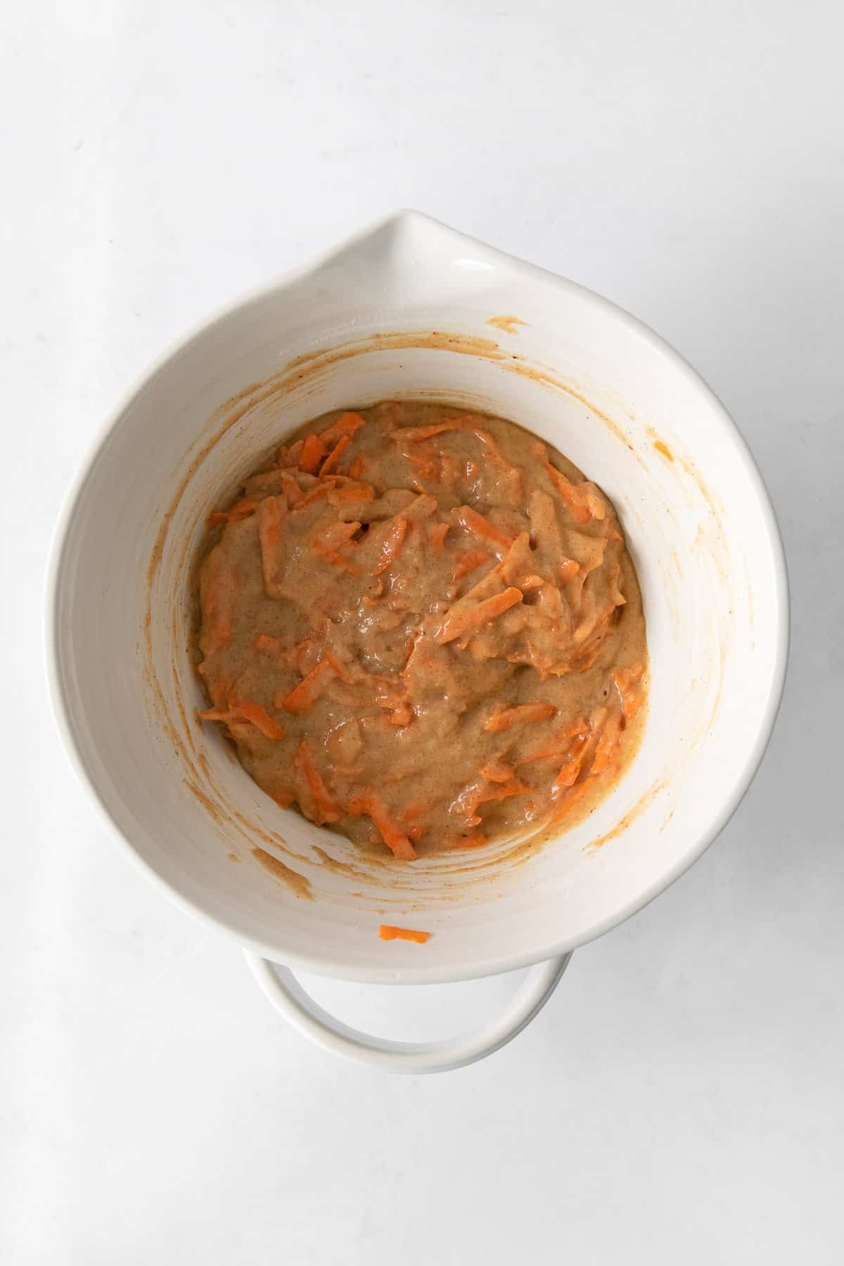 Carrot cake cupcake batter in a mixing bowl. 