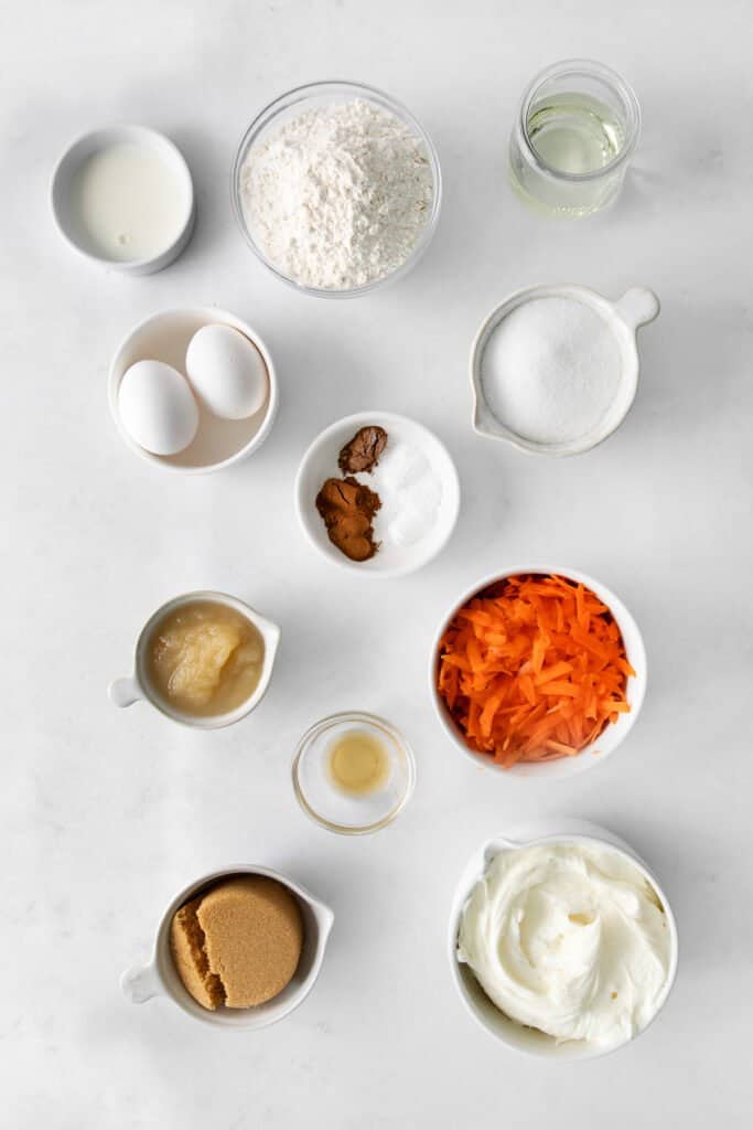 Ingredients for carrot cake cupcakes in small bowls. 