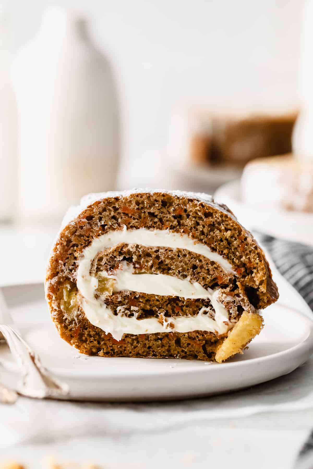 carrot cake roll on a plate