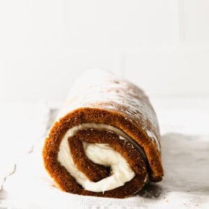 a pumpkin roll is sitting on a piece of paper.