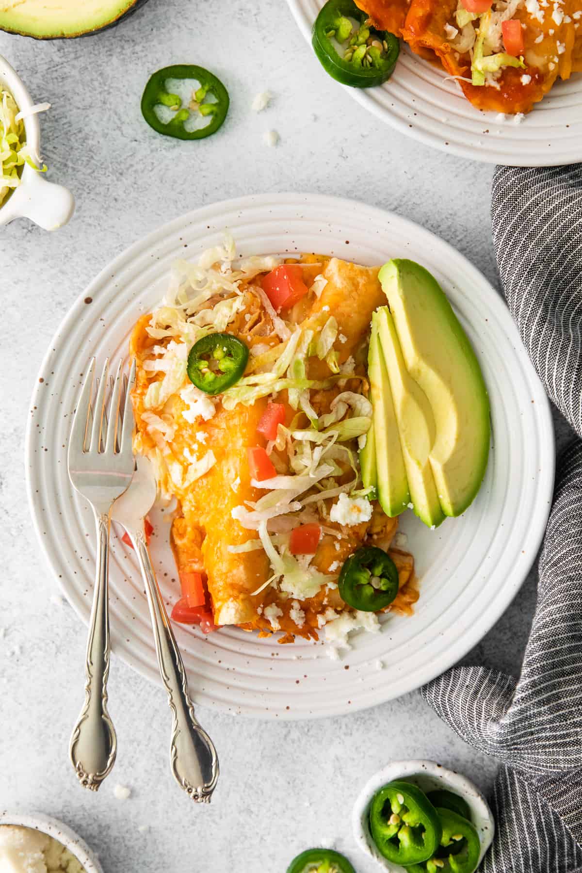 Cheese enchiladas on a plate.