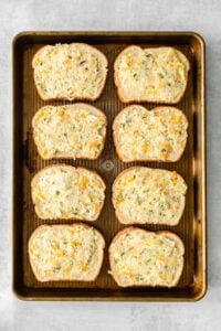 cheesy garlic bread on a baking sheet.