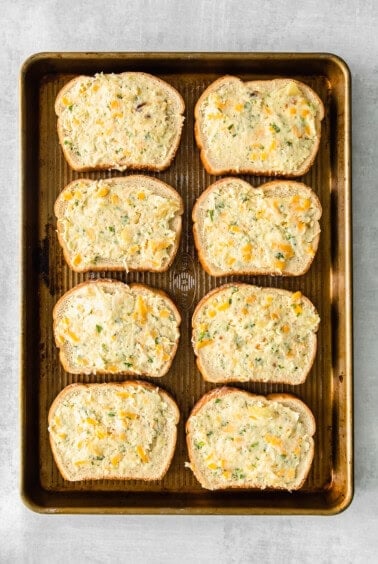 cheesy garlic bread on a baking sheet.