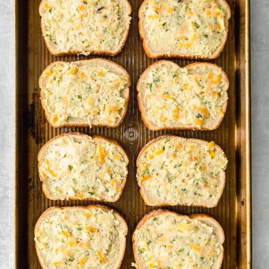 cheesy garlic bread on a baking sheet.