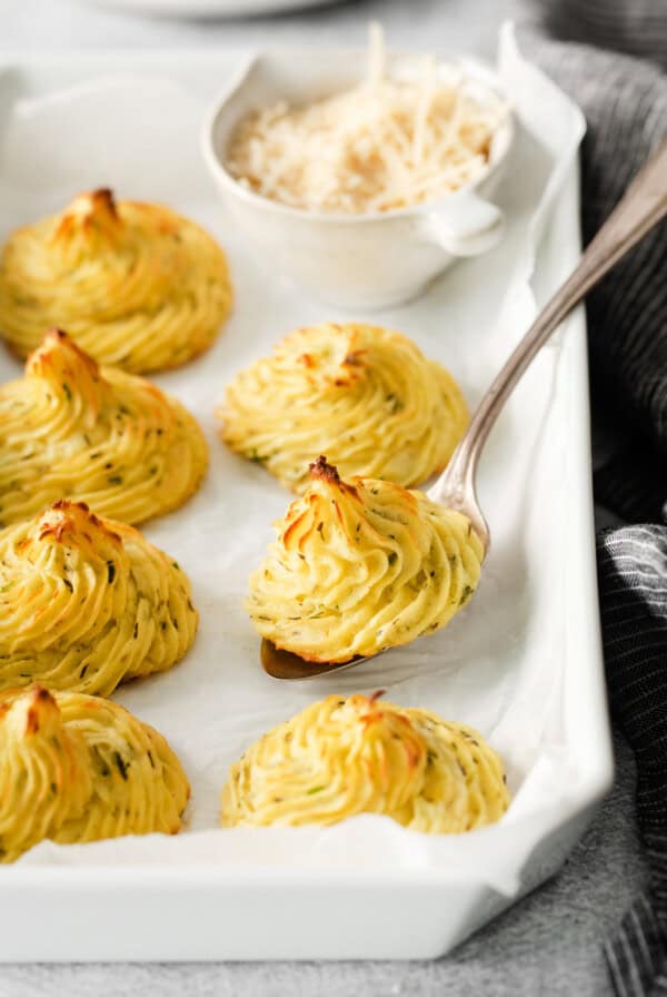 duchess potatoes on a baking sheet.