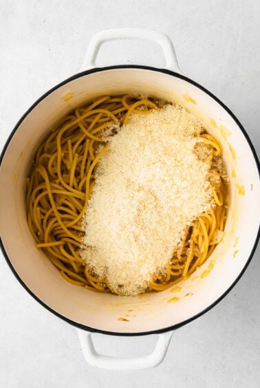 Finely grated parmesan pasta on top of the cooked pasta.