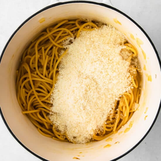 Finely grated parmesan pasta on top of the cooked pasta.