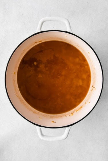 Deglazed broth and wine in a Dutch Oven.