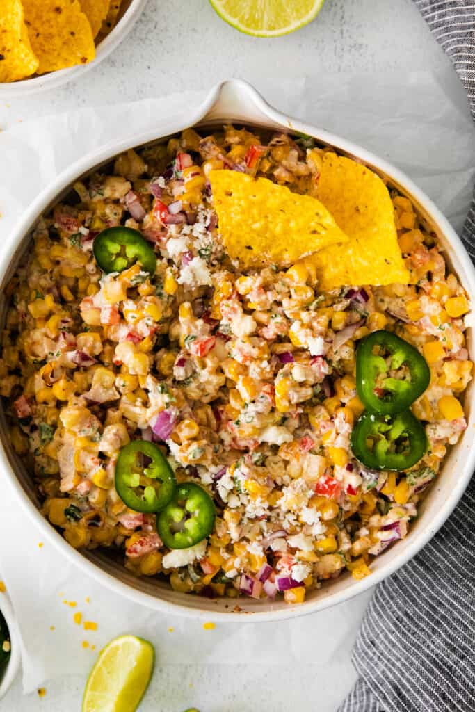 mexican corn salad topped with fresh jalapenos.