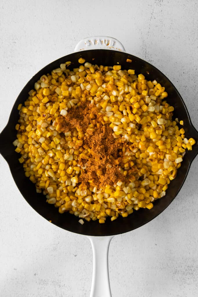 sweet corn browning in a cast iron skillet