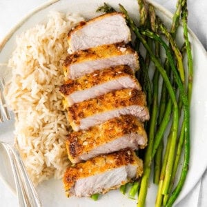 Parmesan Crusted Pork Chops on a plate.