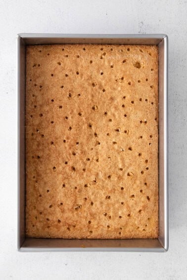 graham cracker bars in a metal pan on a white background.