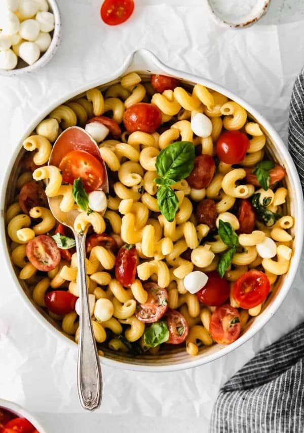 a bowl of caprese pasta salad