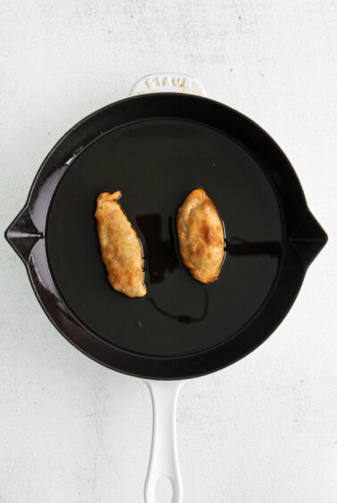 pan frying empanadas.