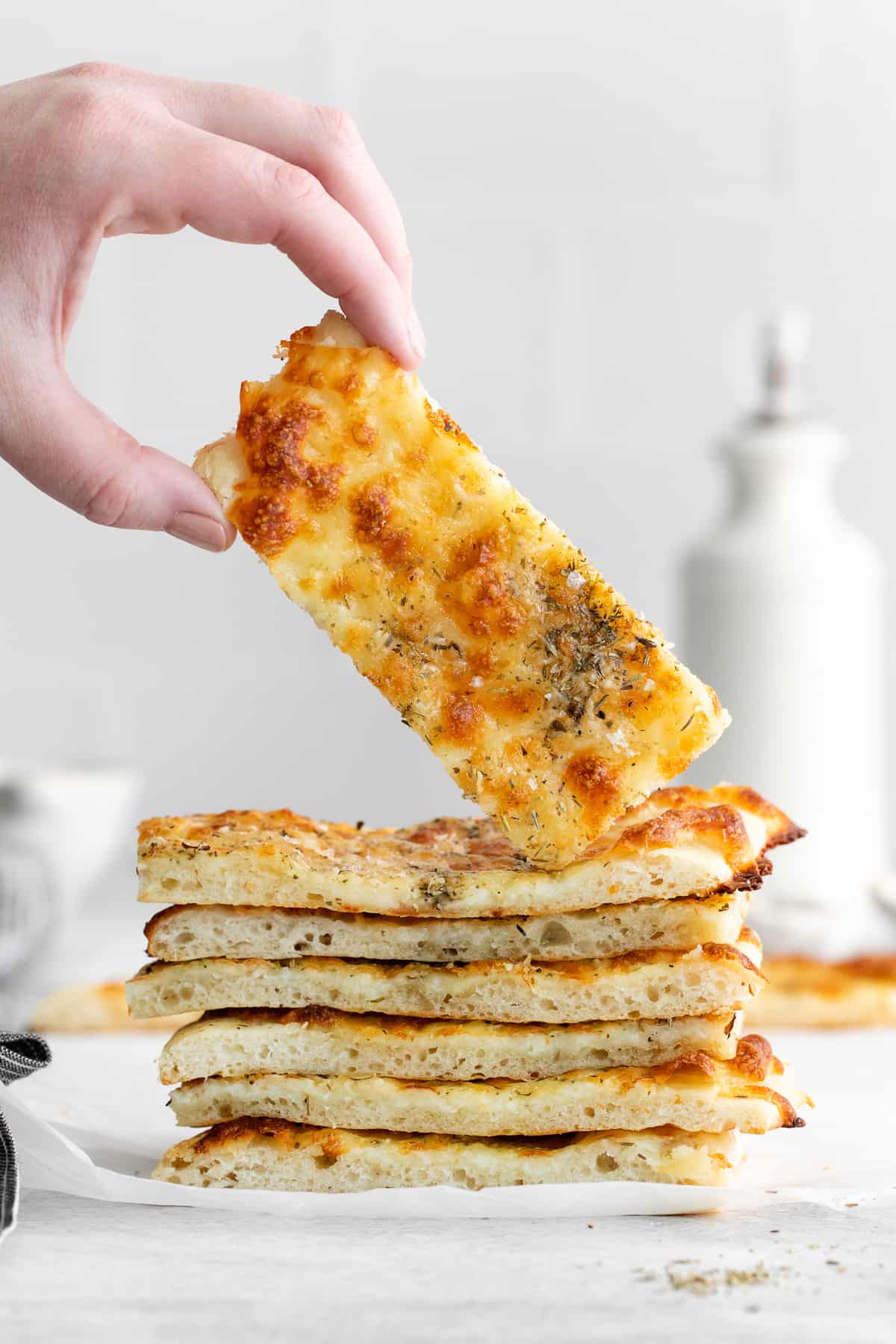 Cheese bread in a hand.