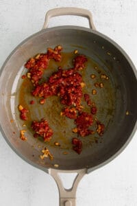 tomato paste in pan.
