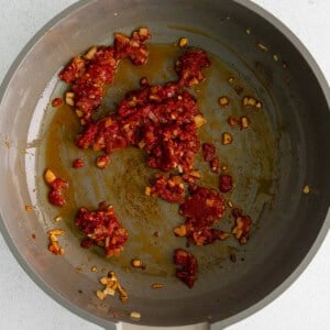 tomato paste in pan.