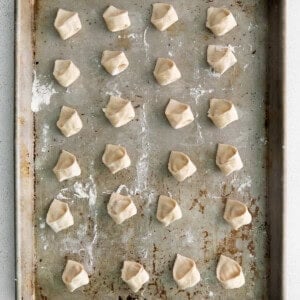 tortellini on baking sheet.