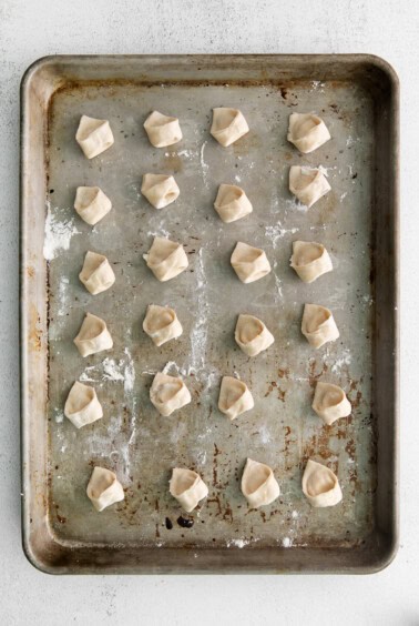 tortellini on baking sheet.