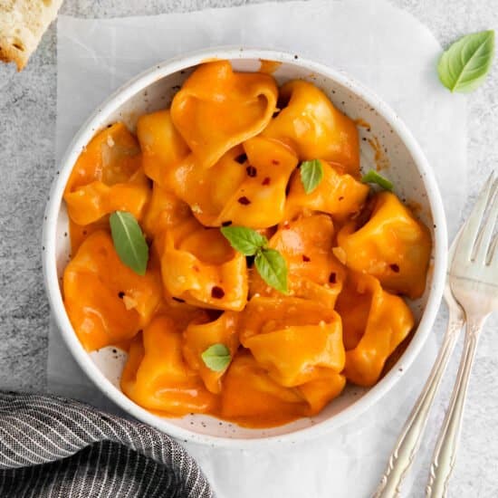 Cheese tortellini in vodka sauce in a bowl.