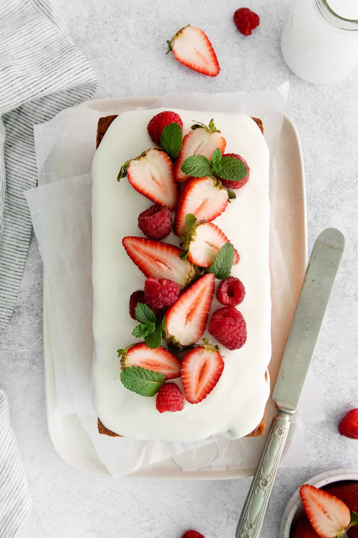 Cream cheese pound caked topped with strawberries and raspberries.