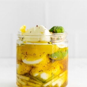 Marinated goat cheese in a jar.