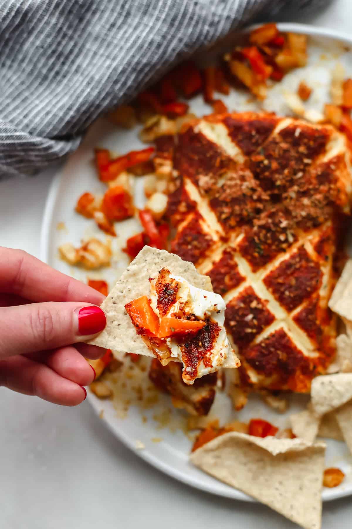 Smoked cream cheese on a tortilla chip.