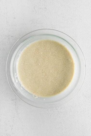 Bisquick, milk, and eggs, in a bowl.